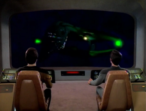 They go into the hole and find a Romulan Warbird