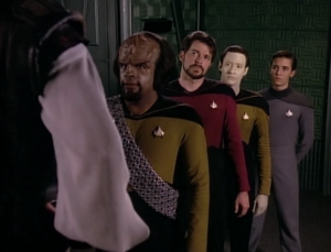 They beam over Okona. Why is everyone hiding behind Worf