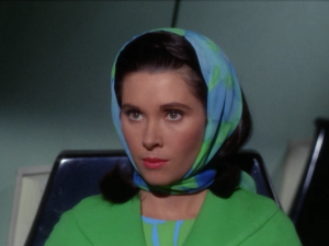 Bones, Spock and Kirk pick up a commissioner that was in the middle of stopping a war because she got a rare disease that can be treated on the Enterprise. She emphasizes the importance of her work and wanting to get back to it as soon as possible. She also always says "the starfleet".