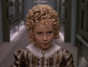 She starts to see holodeck characters outside of the holodeck