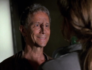 Janeway is saved by a crazy old man who thinks she's his daughter