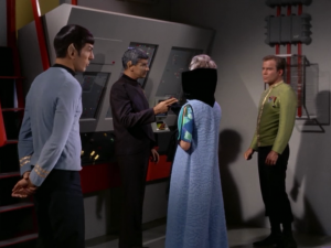 We find out that the Vulcan ambassador is Spock's father, Sarek. Sarek wanted someone other than Spock to give the tour. Kirk still asks Spock to hang around and explain things to them so we're again reminded that there's tension between them
