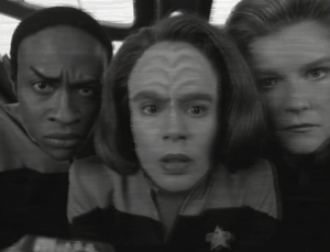 Voyager beams something aboard. Whatever it is, people have to stick their faces really close to it in order to see it