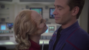 Phlox's wife stands close to Trip