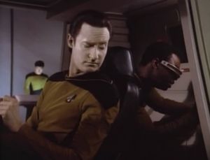 Data and Geordi fix the shuttle and find out it's from 6 hours in the future