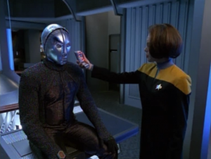 After ten minutes of technobabble they get it running. B'Elanna, it's rude to hold a tricorder right up to someone's face.
