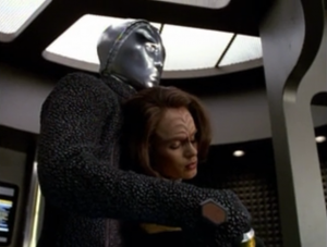 The robot steals B'Elanna and beams over to his ship.