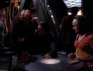 Quark starts hitting things to check if Odo is spying on them