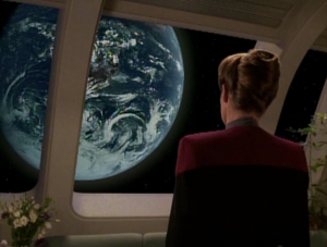 Q says that if Janeway rules in favor of the continuum, they'll take they back to earth. It's another example of the writers trying to raise the stakes, but they actually lower them, because we know they're not going back to earth