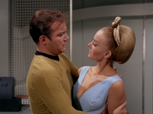 Of course it's Kirk's job to "distract" the main female Kelvan. He goes to her to "apologize" for karate chopping her earlier