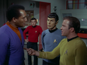 Kirk jabs Dr. Daystrom with his finger