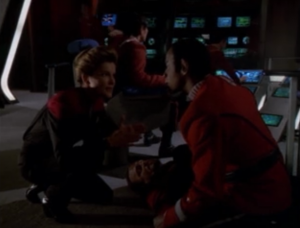 The guy next to Tuvok dies and it triggers flashbacks within the flashback