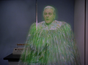 The kids summon a man dressed even stupider than them. He tells them to take the ship to another planet