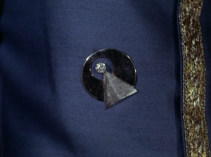 Spock wears an IDIC pin