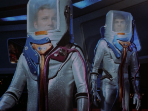 They beam aboard to see what happened wearing sparkly space suits