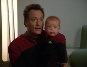 Then a there's a baby. Q wants Janeway to teach the child about all that human love stuff as his godmother