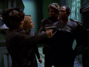 Tuvok tries to sneak in and attach something the Kes' face.