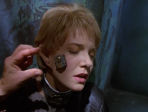 But then Voyager leads an assault and manages to attach a thing to her face