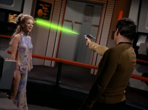 She can move so fast that they couldn't see her. She makes it so Kirk is "accelerated"