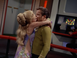 A lady shows up and kisses Kirk