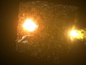 Somehow the former Borg on the planet make it so the Borg cube self-destructs 