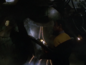 An organic ship is docked with the cube