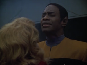Tuvok gives her a quick mind meld to slow her time bomb or something