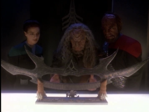 After they follow some clues to a location, and get past a few force fields, they find the sword of Kahless