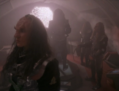 Kira knew how to beam the klingons onto the cardassian ship