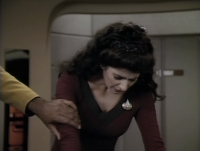 Troi starts feeling dizzy, even when Worf touches her arm