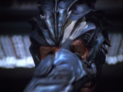 To prepare for combat he puts paint(?) on his helmet