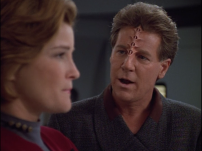 Janeway negotiates with an arms dealer to get some better weapons