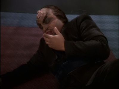 He punches the Klingon lawyer. That's one of the things you shouldn't do when you're on trial