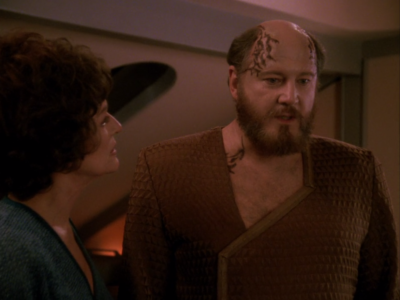 Lwaxana argues with him about his world's traditions. He's specially capable of saving his world, so he really needs to stick around for a bit longer